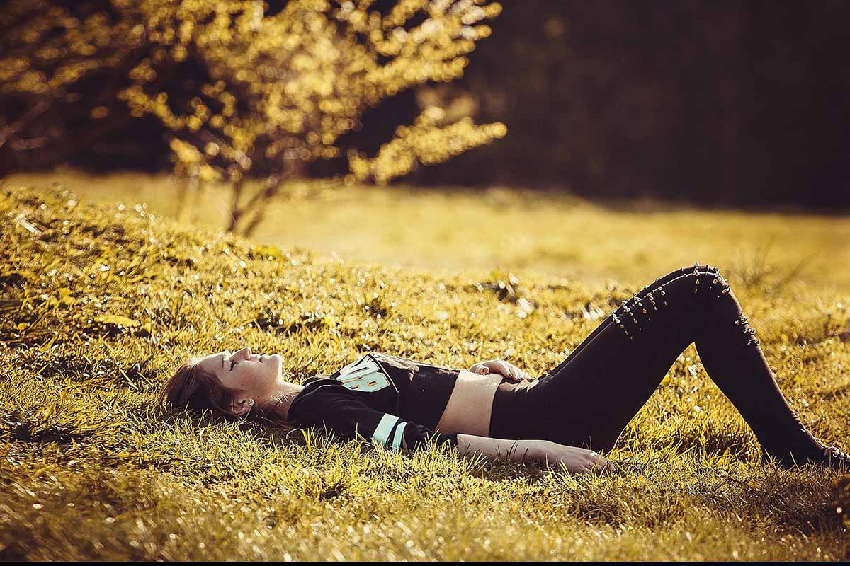 girl lying on the grass